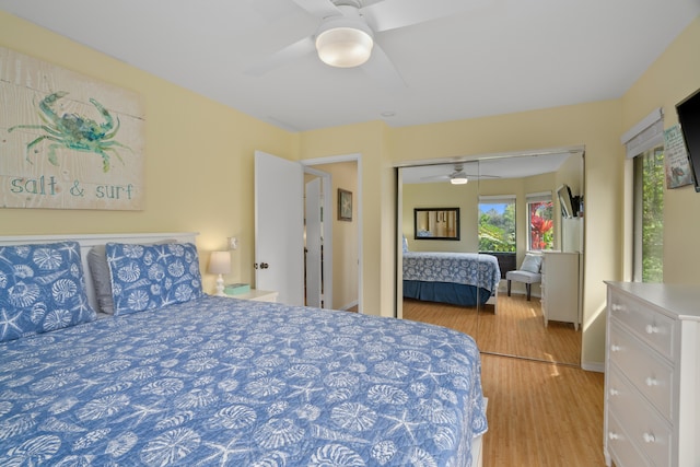 5451 Ka Haku Rd Unit 24, Princeville, HI 96722 - bedroom with wood finished floors, ceiling fan, a closet, and baseboards