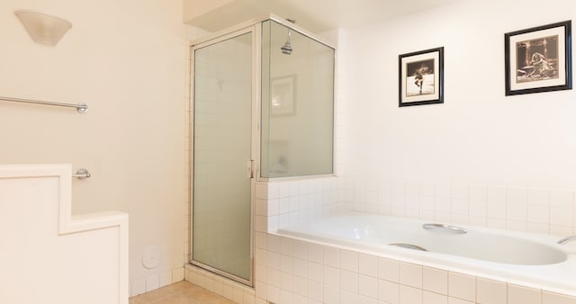 69-1010 Keana Pl Unit F105, Waikoloa, HI 96738 - bathroom with a shower stall, a bath, and tile patterned flooring