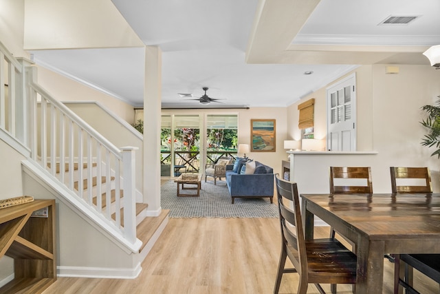 4919 Pepelani Lp Unit 19C, Princeville, HI 96722 - dining space with light wood-type flooring, ornamental molding, stairs, and a ceiling fan