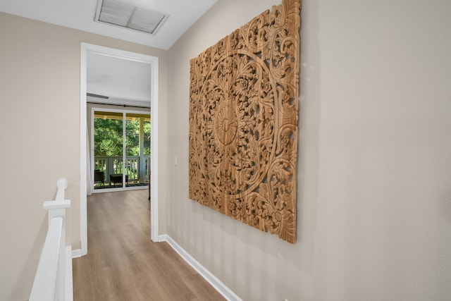 4919 Pepelani Lp Unit 19C, Princeville, HI 96722 - hall featuring an upstairs landing, wood finished floors, and baseboards