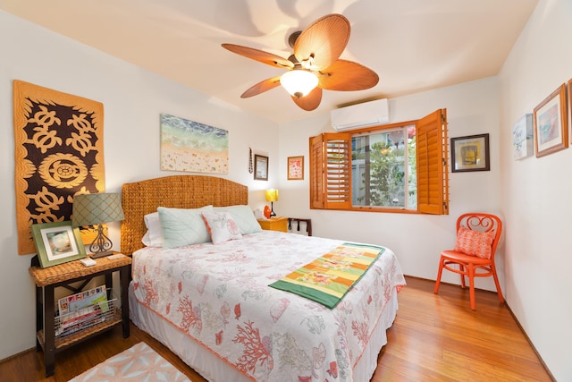 78-6655 Alii Dr, Kailua-Kona, HI 96740 - bedroom featuring a wall unit AC, wood finished floors, and a ceiling fan