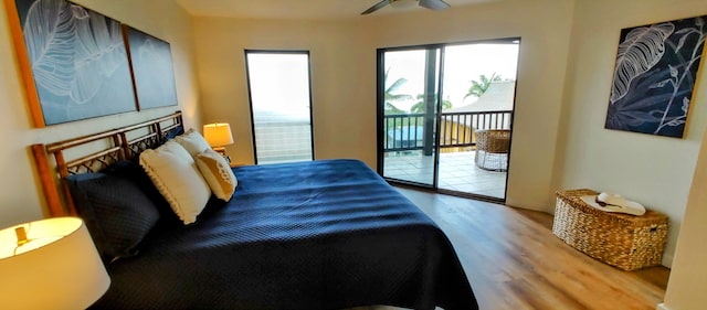 77-305 Kalani Way Unit 6, Kailua-Kona, HI 96740 - bedroom with wood finished floors, access to exterior, and ceiling fan