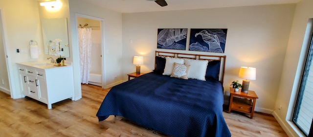77-305 Kalani Way Unit 6, Kailua-Kona, HI 96740 - bedroom featuring light wood-style floors, baseboards, and a sink