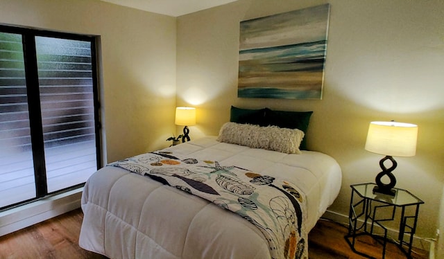 77-305 Kalani Way Unit 6, Kailua-Kona, HI 96740 - bedroom with baseboards, wood finished floors, and multiple windows