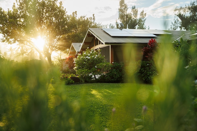5-8192 Kuhio Hwy, Hanalei, HI 96714 - view of home's exterior with roof mounted solar panels and metal roof