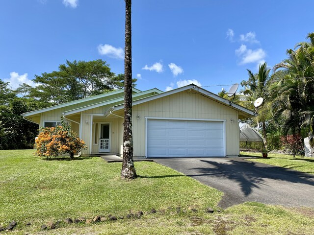 15-1676 6th Ave, Keaau, HI 96749 - view of front of home with an attached garage, a front yard, and driveway