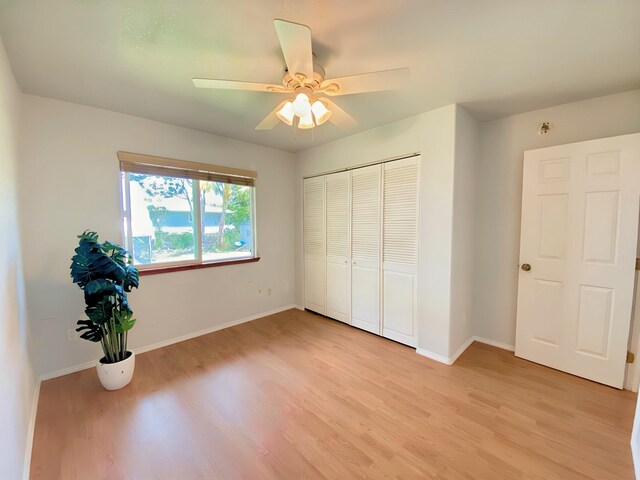 15-1676 6th Ave, Keaau, HI 96749 - unfurnished bedroom featuring light wood-type flooring, baseboards, and a closet