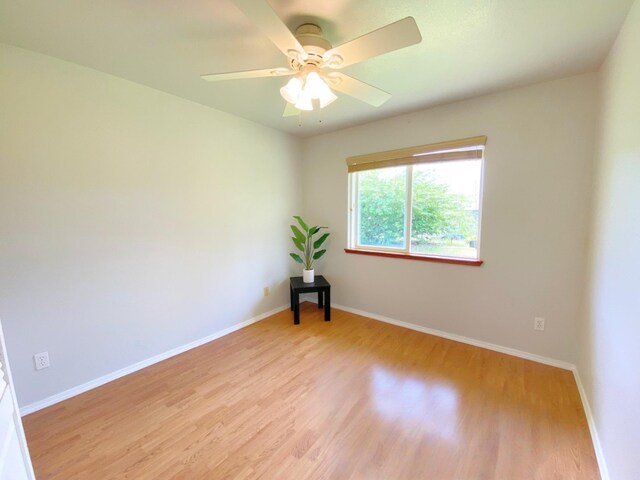 15-1676 6th Ave, Keaau, HI 96749 - spare room with light wood-style flooring, baseboards, and a ceiling fan