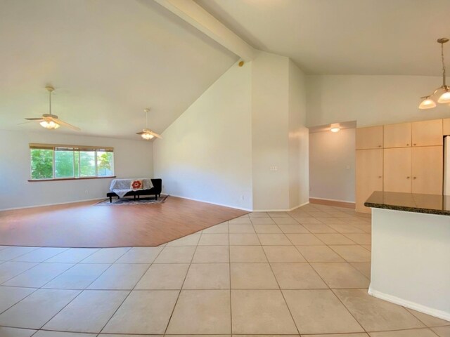 15-1676 6th Ave, Keaau, HI 96749 - unfurnished living room featuring beamed ceiling, light tile patterned floors, high vaulted ceiling, ceiling fan, and baseboards