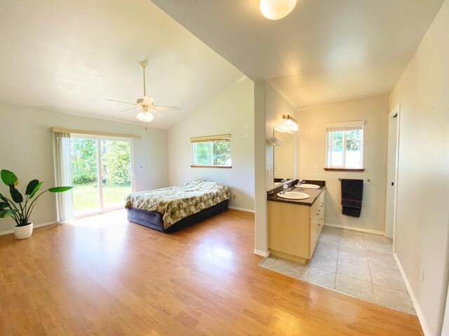 15-1676 6th Ave, Keaau, HI 96749 - bedroom with access to exterior, multiple windows, light wood-style floors, baseboards, and lofted ceiling