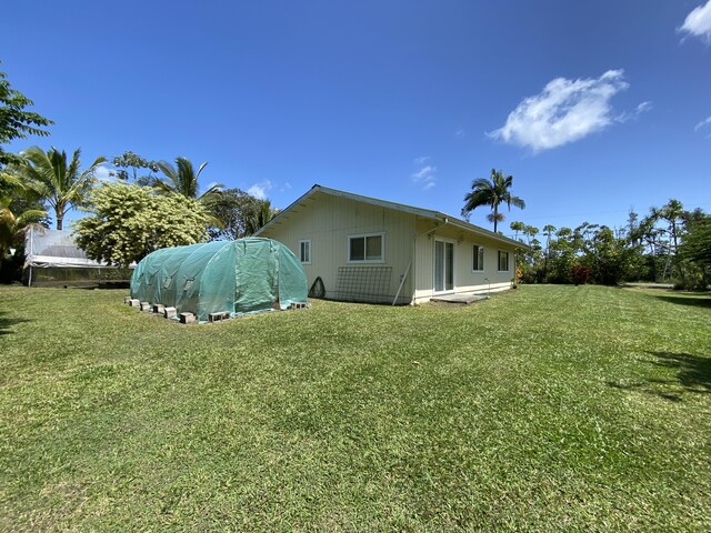15-1676 6th Ave, Keaau, HI 96749 - rear view of house featuring a lawn