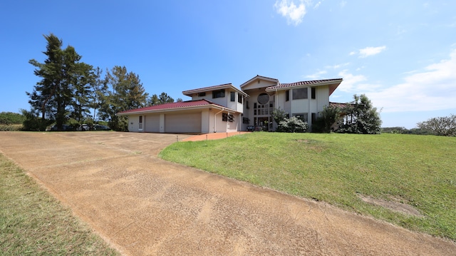 5370 Kaehulua Rd, Kapaa, HI 96746 - view of front of property with a front yard, driveway, and a garage