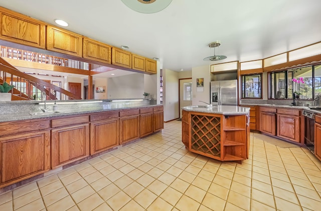 5370 Kaehulua Rd, Kapaa, HI 96746 - kitchen with stainless steel refrigerator with ice dispenser, open shelves, a sink, dishwasher, and light tile patterned floors