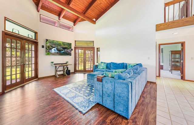 5370 Kaehulua Rd, Kapaa, HI 96746 - living room with french doors, wooden ceiling with exposed beams, wood finished floors, plenty of natural light, and high vaulted ceiling
