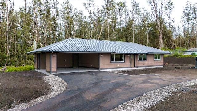 16-2112 Tangerine Dr, Pahoa, HI 96778 - single story home with metal roof, driveway, and a carport