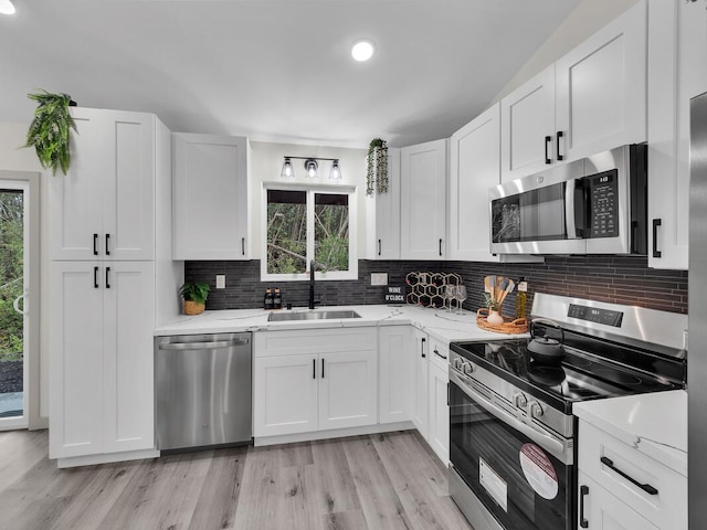 16-2112 Tangerine Dr, Pahoa, HI 96778 - kitchen featuring appliances with stainless steel finishes, a sink, plenty of natural light, and tasteful backsplash
