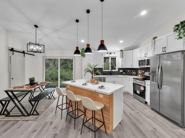16-2112 Tangerine Dr, Pahoa, HI 96778 - kitchen featuring appliances with stainless steel finishes, plenty of natural light, a center island, tasteful backsplash, and recessed lighting