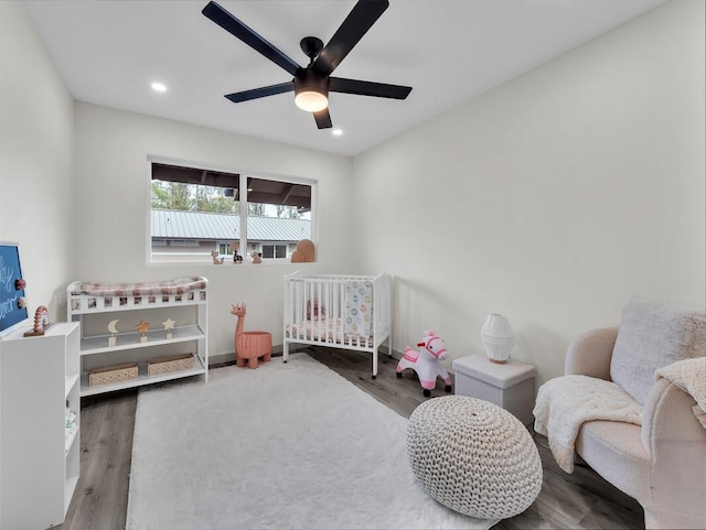 16-2112 Tangerine Dr, Pahoa, HI 96778 - bedroom with a crib, wood finished floors, recessed lighting, and a ceiling fan