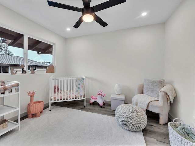 16-2112 Tangerine Dr, Pahoa, HI 96778 - bedroom with wood finished floors, recessed lighting, a crib, baseboards, and a ceiling fan