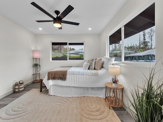 16-2112 Tangerine Dr, Pahoa, HI 96778 - bedroom featuring multiple windows, wood finished floors, recessed lighting, a ceiling fan, and baseboards