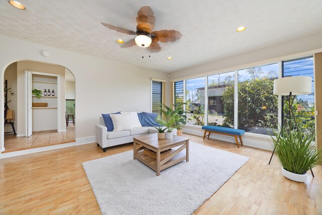 15-1506 23rd Ave, Keaau, HI 96749 - living area featuring arched walkways, ceiling fan, recessed lighting, light wood finished floors, and baseboards