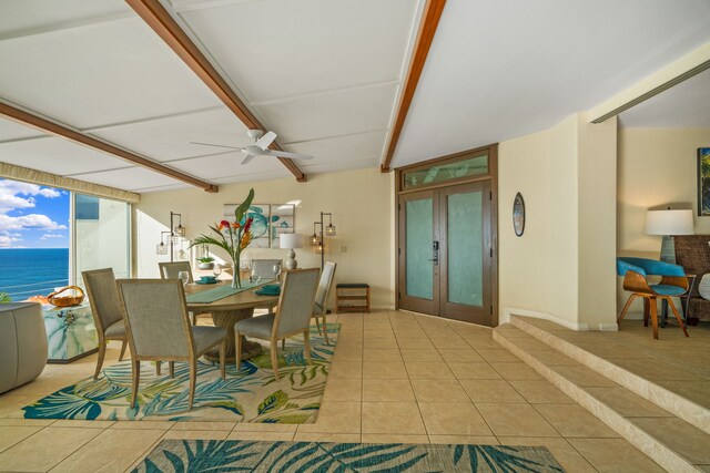 5454 Ka Haku Rd Unit 307, Princeville, HI 96722 - tiled dining area with a ceiling fan, french doors, beam ceiling, and a water view