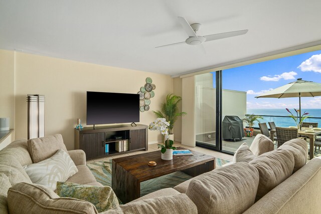 5454 Ka Haku Rd Unit 307, Princeville, HI 96722 - living area with ceiling fan, a wall of windows, and baseboards