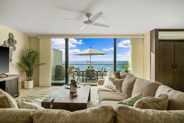 5454 Ka Haku Rd Unit 307, Princeville, HI 96722 - living area featuring expansive windows, a ceiling fan, a water view, and an AC wall unit