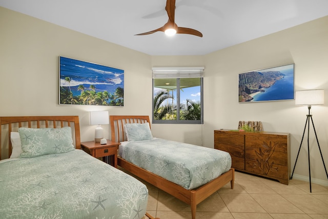 5454 Ka Haku Rd Unit 307, Princeville, HI 96722 - bedroom with light tile patterned floors, baseboards, and a ceiling fan