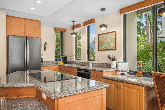 5454 Ka Haku Rd Unit 307, Princeville, HI 96722 - kitchen featuring black appliances, a sink, hanging light fixtures, dark stone counters, and recessed lighting