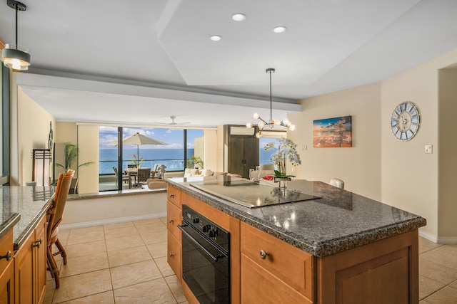 5454 Ka Haku Rd Unit 307, Princeville, HI 96722 - kitchen featuring black oven, electric stovetop, brown cabinetry, recessed lighting, and light tile patterned floors
