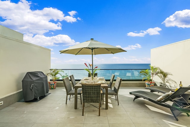5454 Ka Haku Rd Unit 307, Princeville, HI 96722 - view of patio / terrace with a grill, a water view, and outdoor dining area