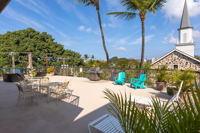75-5719 Alii Dr Unit 414, Kailua-Kona, HI 96740 - view of patio / terrace with a grill and outdoor dining space