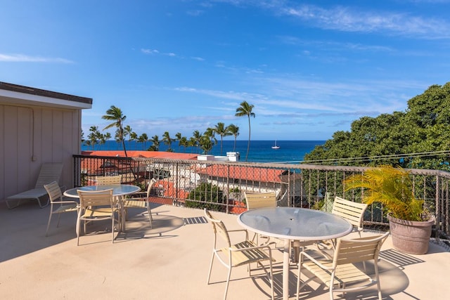 75-5719 Alii Dr Unit 414, Kailua-Kona, HI 96740 - view of patio / terrace featuring outdoor dining space, a water view, and a balcony