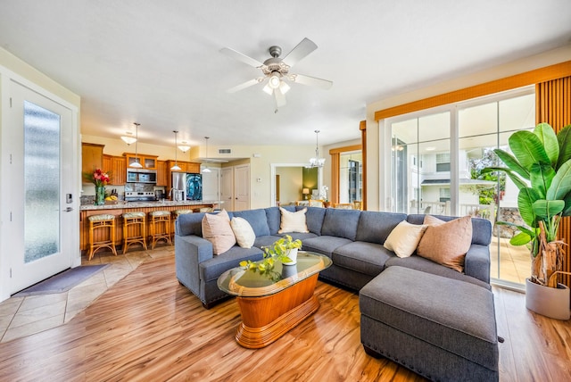 4771 Pepelani Lp Unit 811, Princeville, HI 96722 - living room with light wood finished floors and a ceiling fan
