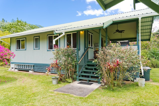 15-2021 11th Ave, Keaau, HI 96749 - view of front of house with a ceiling fan, a front yard, covered porch, and metal roof