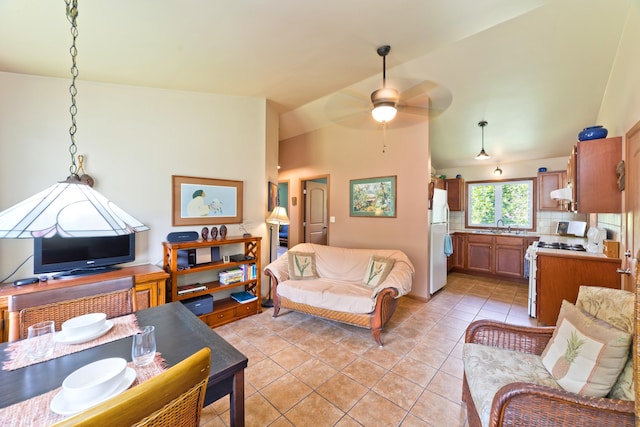 15-2021 11th Ave, Keaau, HI 96749 - living area featuring vaulted ceiling, a ceiling fan, and light tile patterned floors