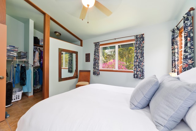 15-2021 11th Ave, Keaau, HI 96749 - tiled bedroom with vaulted ceiling, a closet, a walk in closet, and ceiling fan