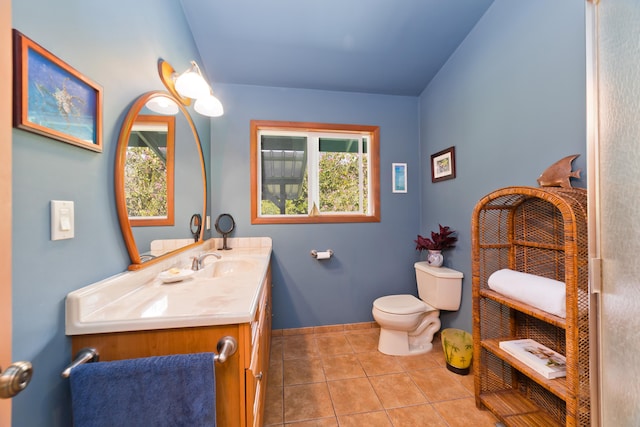 15-2021 11th Ave, Keaau, HI 96749 - bathroom featuring vanity, toilet, plenty of natural light, and tile patterned floors