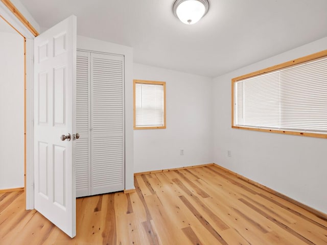 92-8215 Bamboo Ln, Ocean View, HI 96737 - unfurnished bedroom featuring wood finished floors, a closet, and baseboards