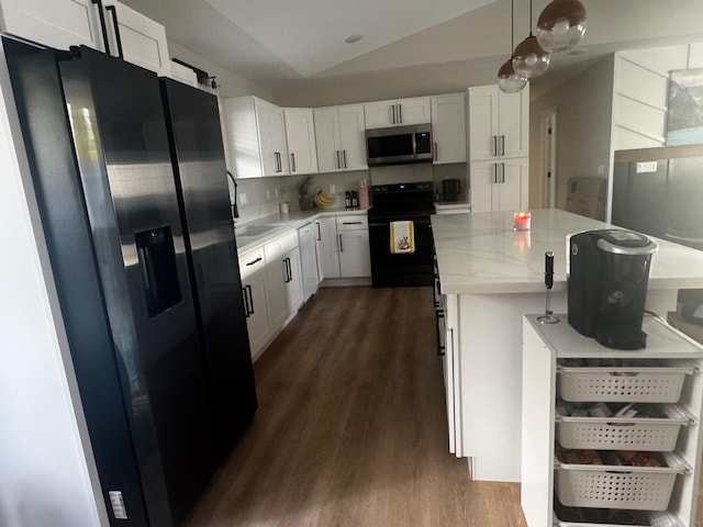 16-2062 Paradise Dr, Pahoa, HI 96778 - kitchen with black appliances, dark wood finished floors, white cabinetry, a center island, and lofted ceiling