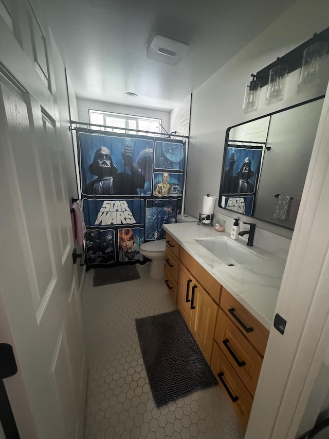 16-2062 Paradise Dr, Pahoa, HI 96778 - bathroom with vanity, toilet, a shower, and tile patterned flooring