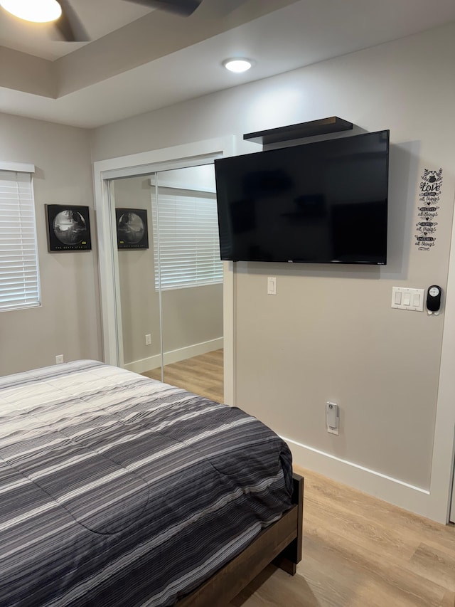 16-2062 Paradise Dr, Pahoa, HI 96778 - bedroom featuring light wood-style flooring, a closet, baseboards, and a ceiling fan