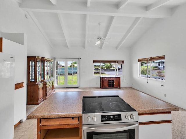 907 Mala Pua Way, Hilo, HI 96720 - kitchen with stainless steel electric stove, freestanding refrigerator, open floor plan, ceiling fan, and light countertops