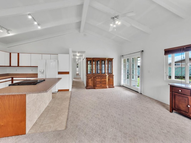 907 Mala Pua Way, Hilo, HI 96720 - kitchen with white refrigerator with ice dispenser, track lighting, healthy amount of natural light, a ceiling fan, and beamed ceiling