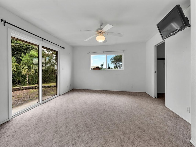 907 Mala Pua Way, Hilo, HI 96720 - unfurnished bedroom with access to outside, carpet floors, and ceiling fan
