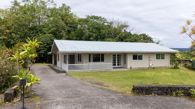 907 Mala Pua Way, Hilo, HI 96720 - ranch-style house featuring a porch, a front lawn, metal roof, french doors, and driveway