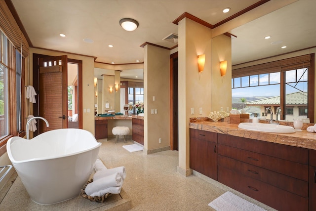 68-108 Pukaua Pl, Kamuela, HI 96743 - bathroom with baseboards, vanity, a soaking tub, recessed lighting, and crown molding
