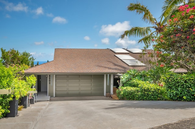 4282 Kalaheo Dr, Kalaheo, HI 96741 - view of front of home with driveway, an attached garage, stucco siding, and roof with shingles