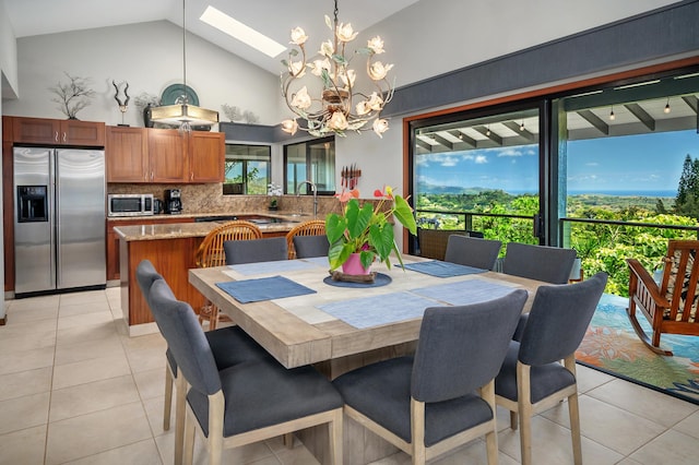 4282 Kalaheo Dr, Kalaheo, HI 96741 - dining room featuring plenty of natural light, a chandelier, light tile patterned floors, and high vaulted ceiling